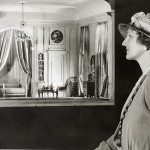 A woman looking at the miniatures displayed in The Thorne Room